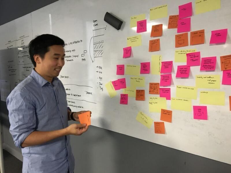 Shek, one of our designers, sharing an idea about automation in our brainstorm.